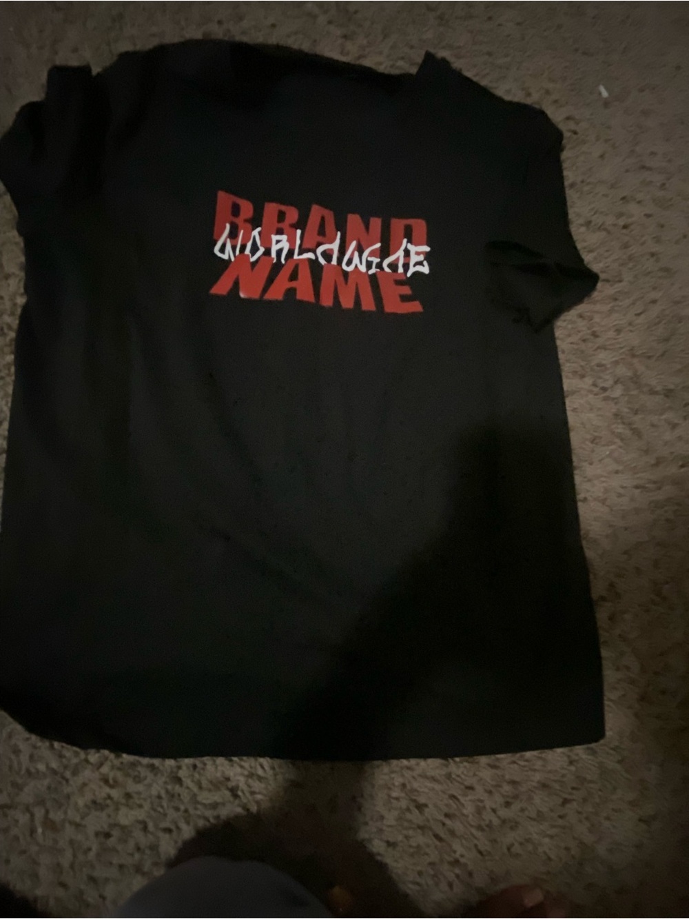 Black Graphic Tee with Red 'Brand Name' Logo